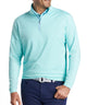 Men's quarter-zip stretch pullover in light teal with ribbed half-zip collar.
