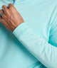 Men's quarter-zip stretch pullover sleeve cuff in light teal with thumb-ready fit.