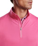 Men's quarter-zip stretch pullover close-up in bright pink with zip and mock collar.