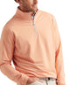 Peach stretch quarter-zip pullover worn with a visible half-zip collar.