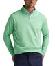 Peter Millar Perth performance quarter-zip in pear tart, lifestyle shot showing versatile styling