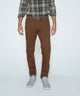 Brown stretch denim jeans with belt loops and button fly, front view.