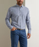 Blue plaid performance flannel button-up shirt on model, long sleeves