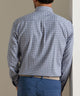 Back view of blue plaid performance flannel button-up shirt with yoke seam