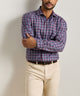 Men's blue plaid performance flannel button-up shirt on model, long sleeves