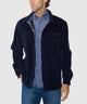 Navy knit corded shirt jacket worn by model, with chest pocket and plaid shirt underneath