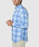 Men's blue plaid long-sleeve button-down shirt in side profile with button cuffs