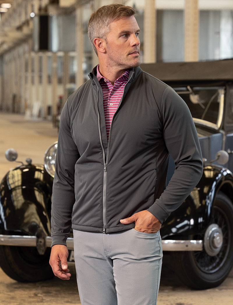 Male model wearing Peter Millar Merge Hybrid Full-Zip Jacket