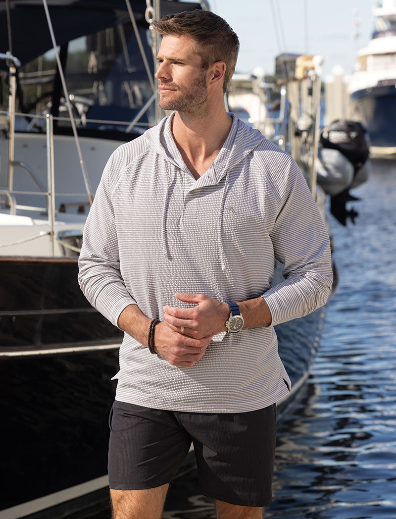 Male model wearing Tommy Bahama Costa Wave Starboard Stripe Hoodie